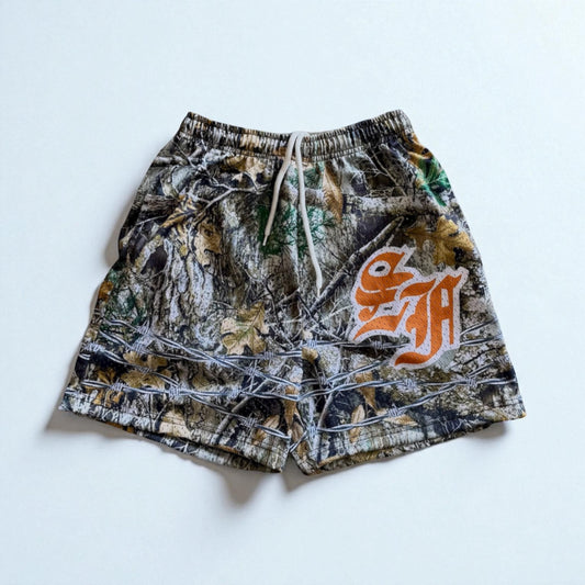 -BARBED CAMO MESH SHORTS